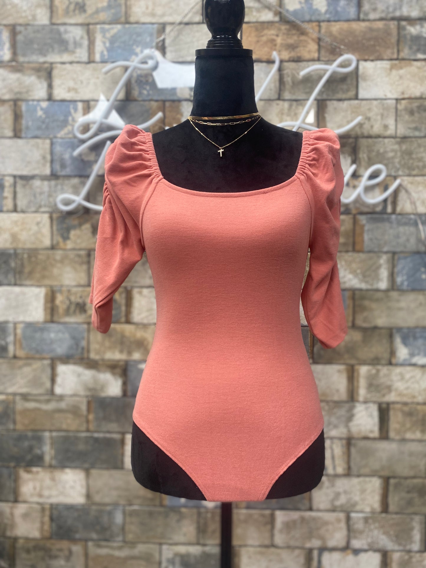 Pink body suit