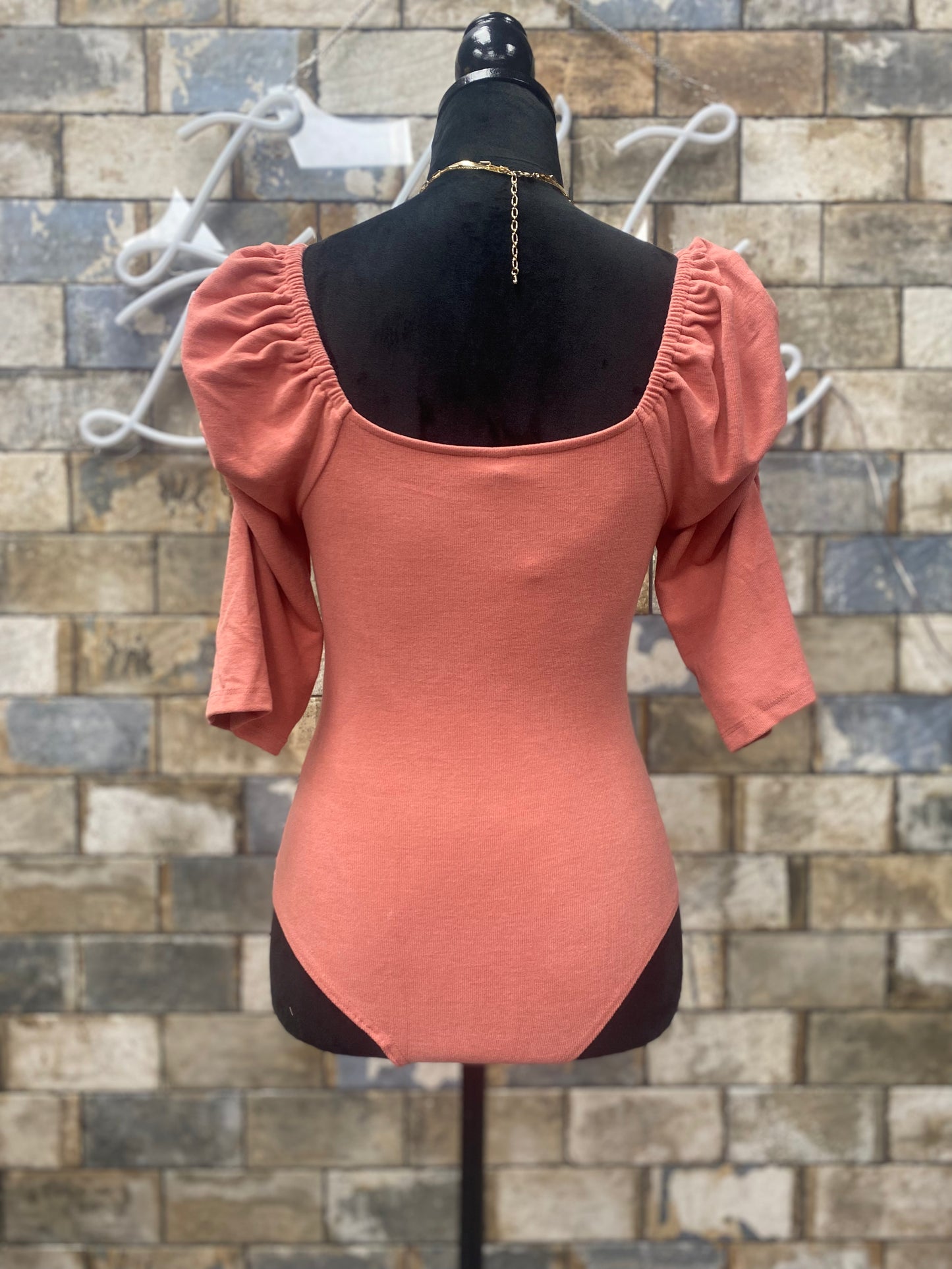 Pink body suit